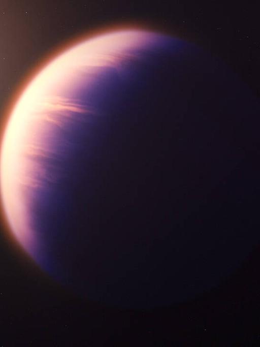 Der Planet WASP-39b, ein heißer Gasriese, umkreist in 700 Lichtjahren Entfernung von der Erde einen sonnenähnlichen Stern (Illustration)