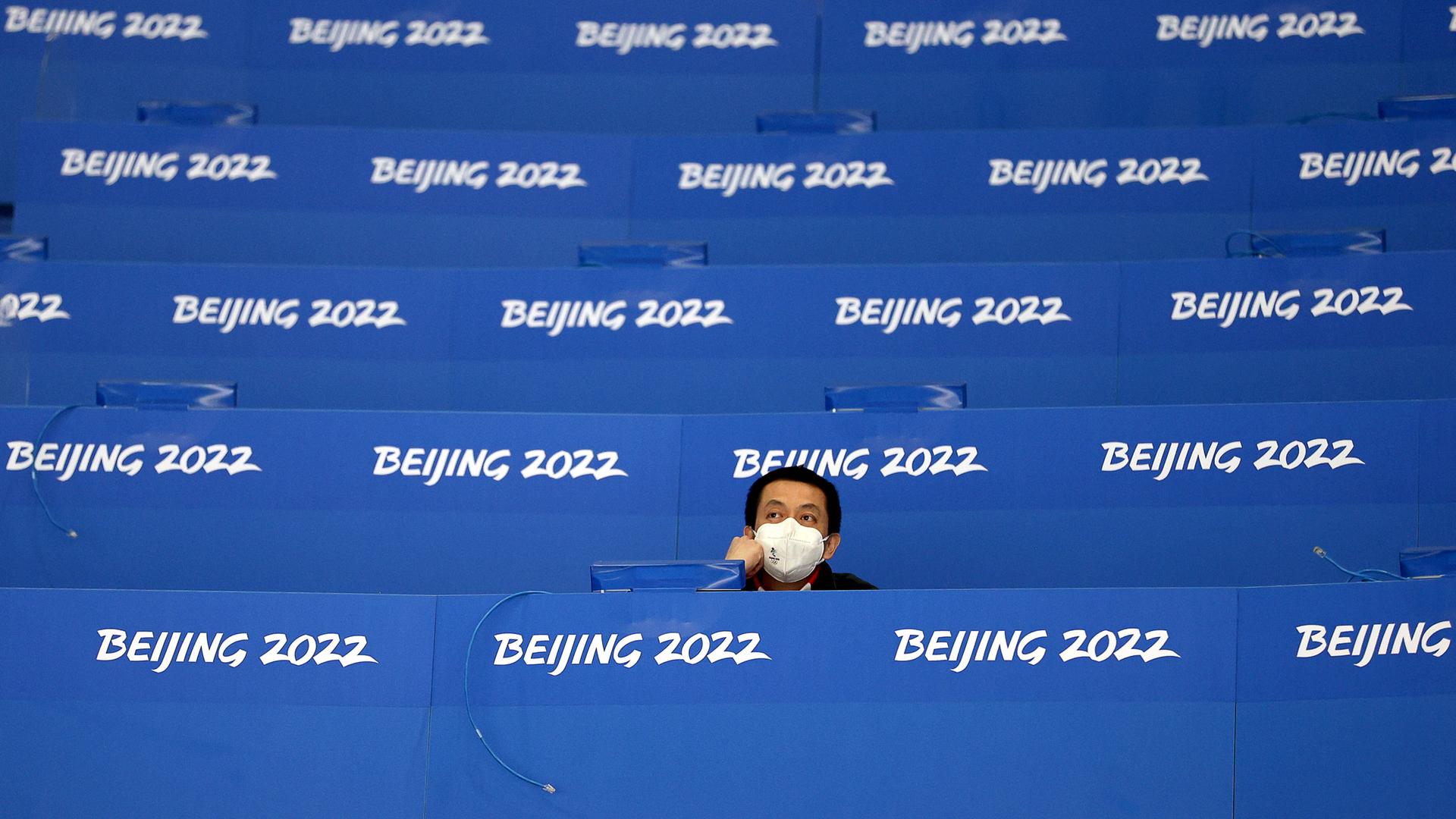 BEIJING, CHINA - FEBRUARY 19, 2022: A journalist is seen during the men s bronze medal Ice hockey, Eishockey match betwe BEIJING, CHINA - FEBRUARY 19, 2022: A journalist is seen during the men s bronze medal Ice hockey, Eishockey match betwe
