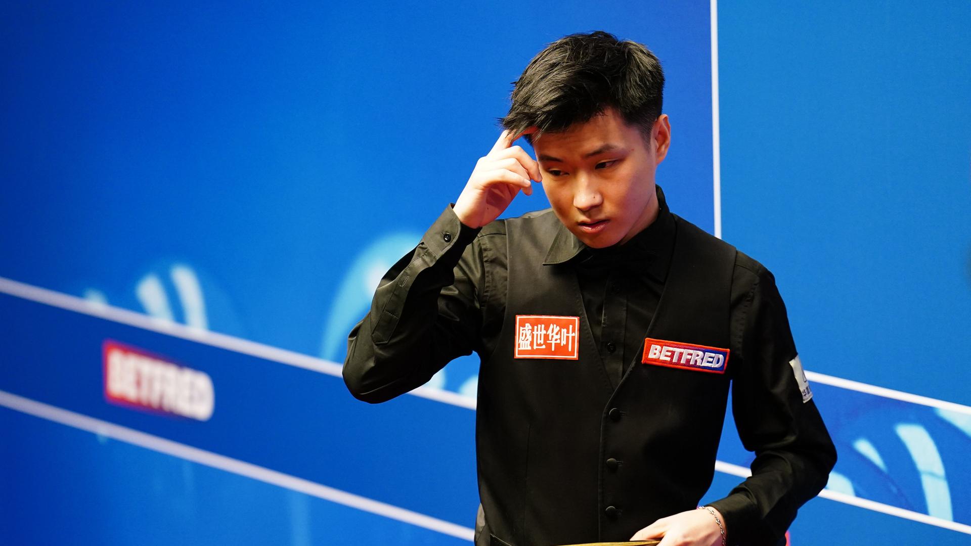 Zhao Xintong file photo. File photo dated 21-04-2022 of Zhao Xintong. Former UK champion Zhao Xintong and Zhang Jiankang have joined the list of players suspended from the World Snooker Tour during an investigation into alleged match-fixing. Issue date: Tuesday January 3, 2022. See PA story SNOOKER Betting. Photo credit should read Mike Egerton/PA Wire. URN:70434426 Zhao Xintong file photo. File photo dated 21-04-2022 of Zhao Xintong. Former UK champion Zhao Xintong and Zhang Jiankang have joined the list of players suspended from the World Snooker Tour during an investigation into alleged match-fixing. Issue date: Tuesday January 3, 2022. See PA story SNOOKER Betting. Photo credit should read Mike Egerton/PA Wire. URN:70434426