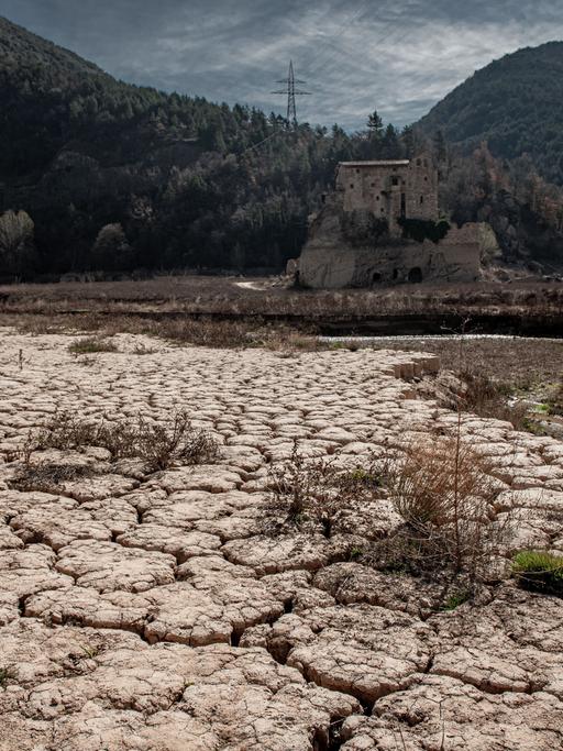 March 20, 2023, Cercs, Barcelona, Spain: The ancient Romanesque monastery of Sant Salvador de la Vedella, which normally is surrounded by water, is seen at the dry riverbed of the Llobregat river while entering the reservoir of La Baells in Cercs, Barcelona Province, Spain. Water restrictions tightened further in Catalonia due to ongoing drought that has now been for 29 months and that is related to climate change and global warming. Currently, Catalan reservoirs are at 27 percent of their capacity. (Credit Image: ÃÂ© Jordi Boixareu/ZUMA Press Wire