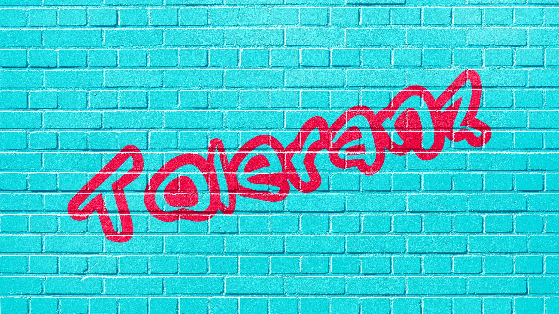 Auf eine türkisfarbenen Wand steht in Rot der Schriftzug Toleranz. Auf eine türkisfarbenen Wand steht in Rot der Schriftzug Toleranz.