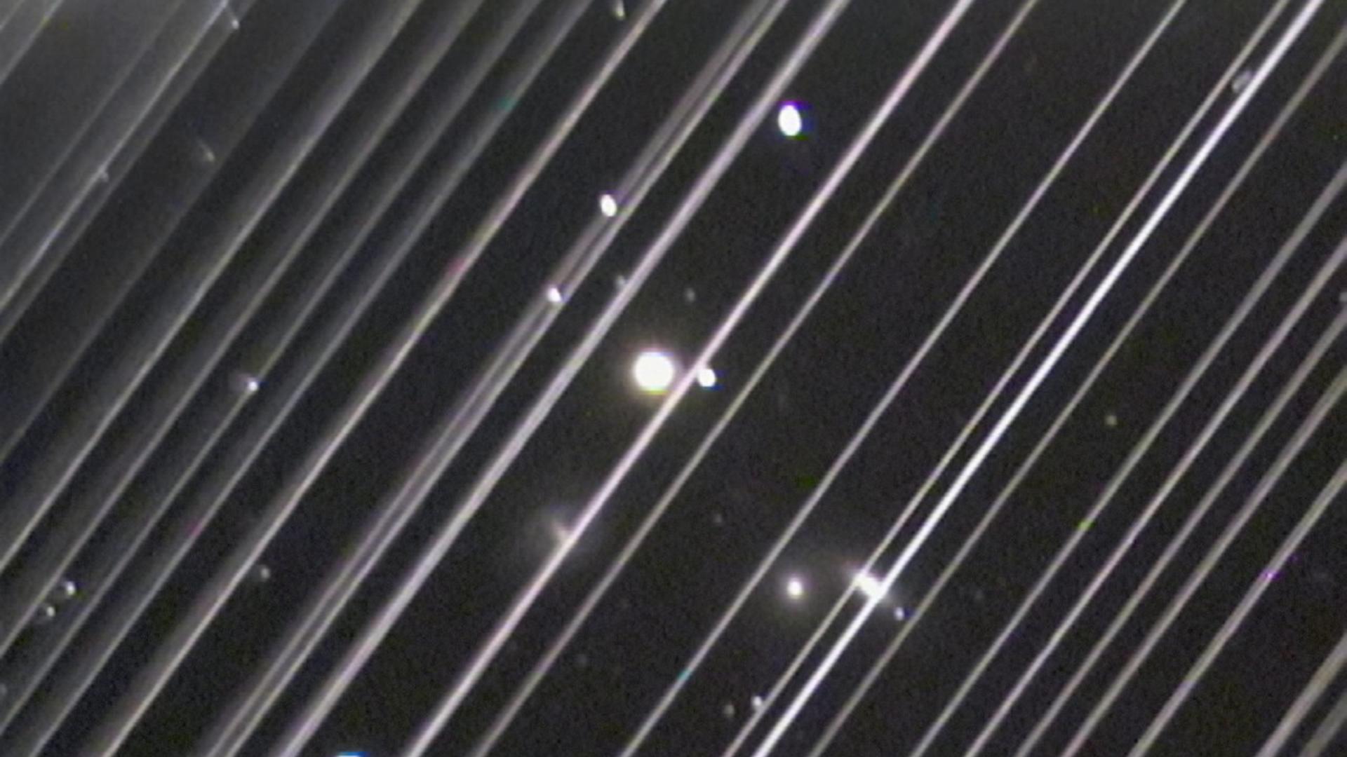 An image of the NGC 5353/4 galaxy group made with a telescope at Lowell Observatory in Arizona, USA on the night of Saturday 25 May 2019. The diagonal lines running across the image are trails of reflected light left by more than 25 of the 60 recently launched Starlink satellites as they passed through the telescopeâs field of view. Although this image serves as an illustration of the impact of reflections from satellite constellations, please note that the density of these satellites is significantly higher in the days after launch (as seen here) and also that the satellites will diminish in brightness as they reach their final orbital altitude. An image of the NGC 5353/4 galaxy group made with a telescope at Lowell Observatory in Arizona, USA on the night of Saturday 25 May 2019. The diagonal lines running across the image are trails of reflected light left by more than 25 of the 60 recently launched Starlink satellites as they passed through the telescopeâs field of view. Although this image serves as an illustration of the impact of reflections from satellite constellations, please note that the density of these satellites is significantly higher in the days after launch (as seen here) and also that the satellites will diminish in brightness as they reach their final orbital altitude.