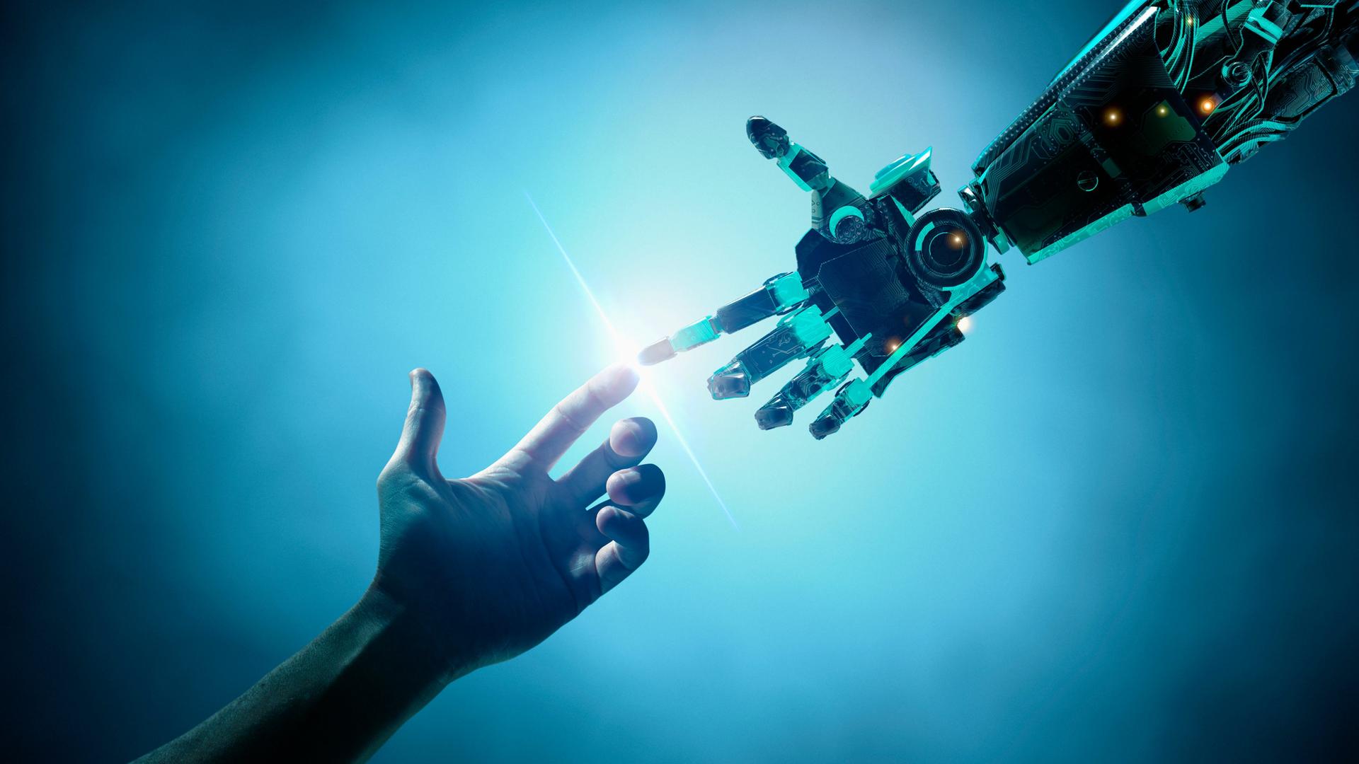 Eine menschliche und eine Roboterhand berühren einander an den Zeigefingern.