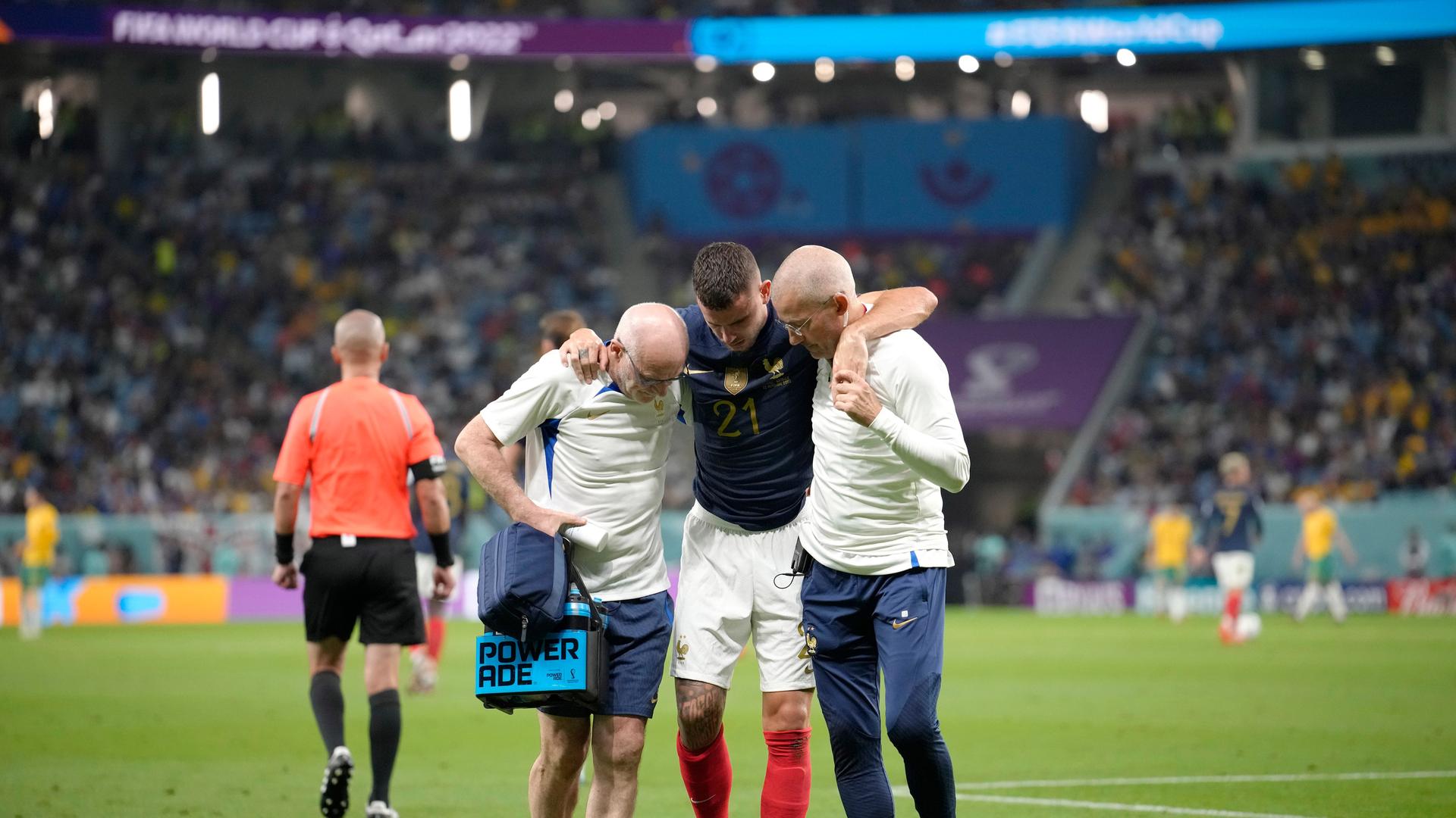 France's Lucas Hernandez is helped off the pitch during the World Cup group D soccer match between France and Australia, at the Al Janoub Stadium in Al Wakrah, Qatar, Tuesday, Nov. 22, 2022. (AP Photo/Christophe Ena) France's Lucas Hernandez is helped off the pitch during the World Cup group D soccer match between France and Australia, at the Al Janoub Stadium in Al Wakrah, Qatar, Tuesday, Nov. 22, 2022. (AP Photo/Christophe Ena)
