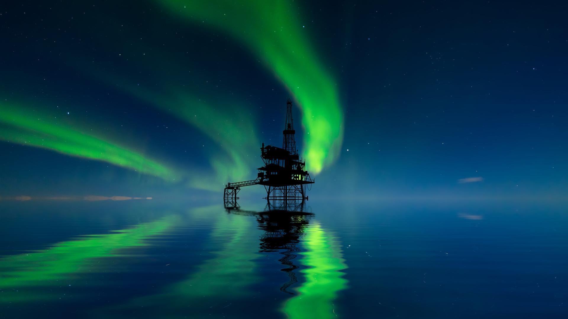 Eine Ölplattform in der Arktis mit Nordlichtern am Himmel. Eine Ölplattform in der Arktis mit Nordlichtern am Himmel.
