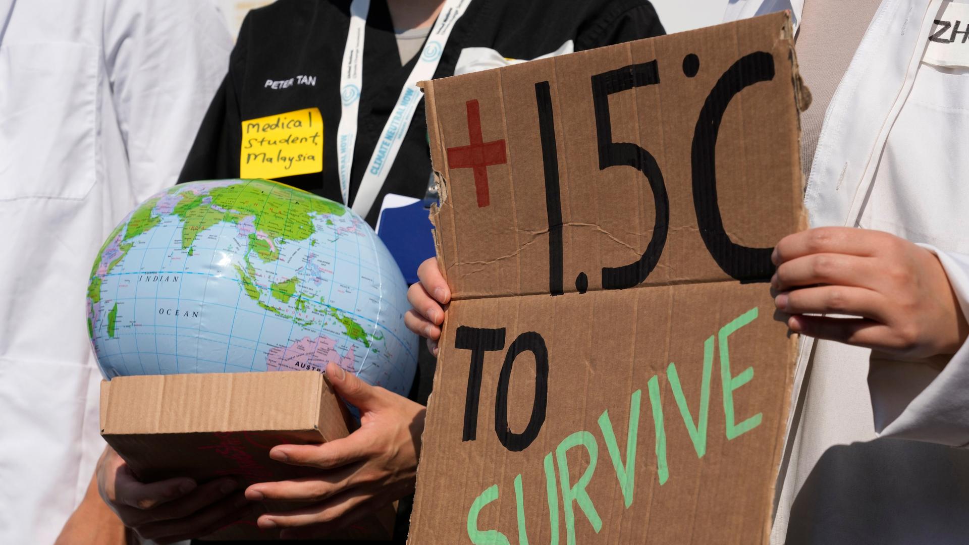 Demonstrators advocate for the 1.5 degree warming goal to survive at the COP27 U.N. Climate Summit, Wednesday, Nov. 16, 2022, in Sharm el-Sheikh, Egypt. (AP Photo/Peter Dejong) Demonstrators advocate for the 1.5 degree warming goal to survive at the COP27 U.N. Climate Summit, Wednesday, Nov. 16, 2022, in Sharm el-Sheikh, Egypt. (AP Photo/Peter Dejong)