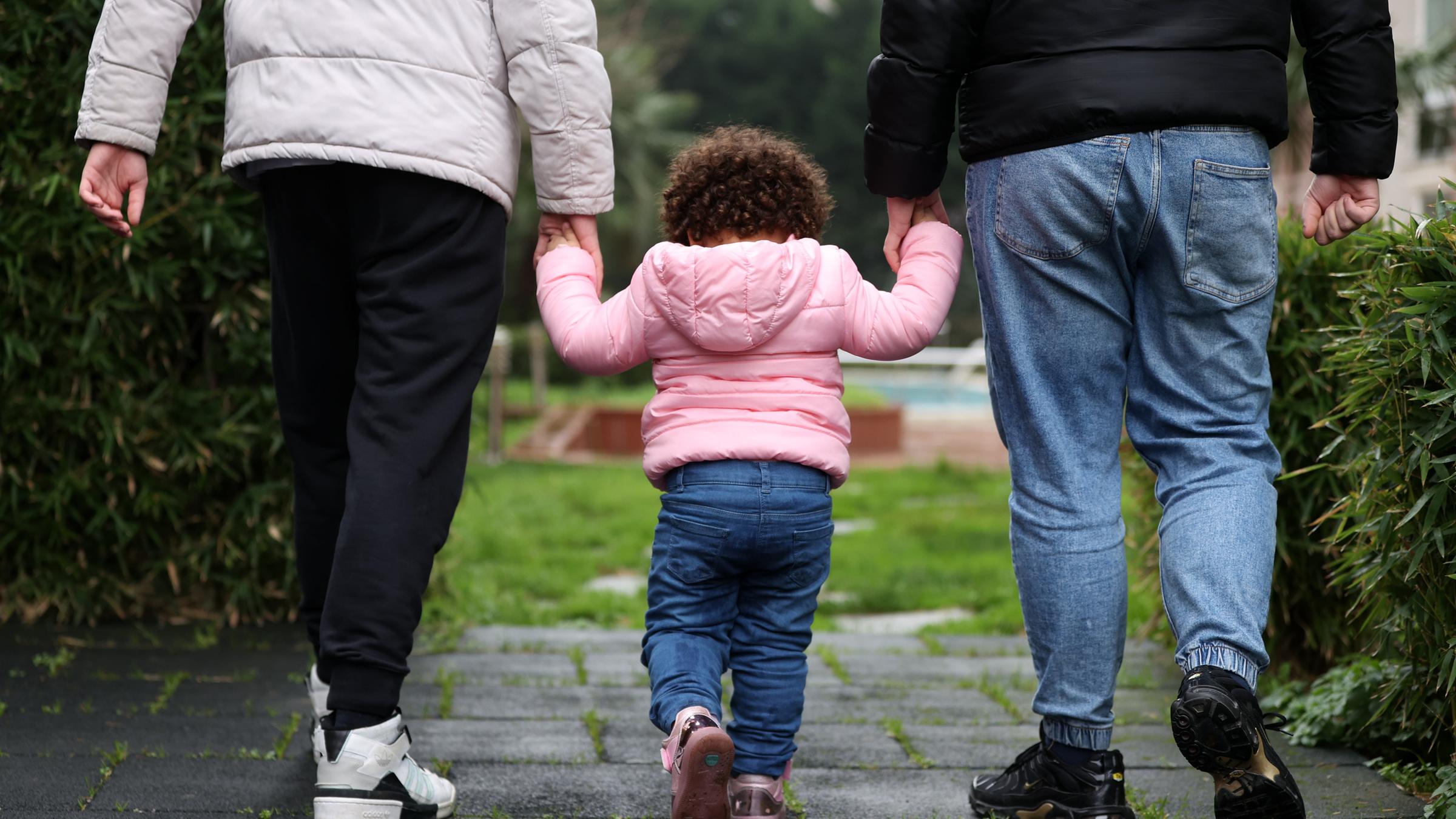 ISTANBUL, TURKIYE - JANUARY 8: 3-year old Syrian girl, Rana is seen playing at a park with her foster family in Beylikduzu district of Istanbul, Turkiye on January 8, 2022. Parents of 2 boys, Doganer couple adopted 3-year-old Syrian girl Rana after deciding to become a foster family. Ali Atmaca / Anadolu Agency