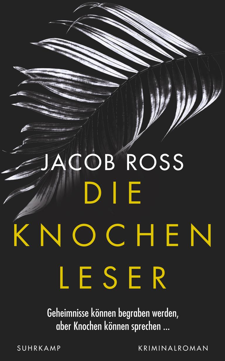 Das Buchcover des Krimis von Jacob Ross, "Die Knochenleser". Jacob Ross und "Die Knochenlesen" steht auf einem meist schwarzem Bild, das oben ein Motiv zeigt, dass an einen Palmenzwei oder ein Knochengerüst erinnert. Das Buchcover des Krimis von Jacob Ross, "Die Knochenleser". Jacob Ross und "Die Knochenlesen" steht auf einem meist schwarzem Bild, das oben ein Motiv zeigt, dass an einen Palmenzwei oder ein Knochengerüst erinnert.