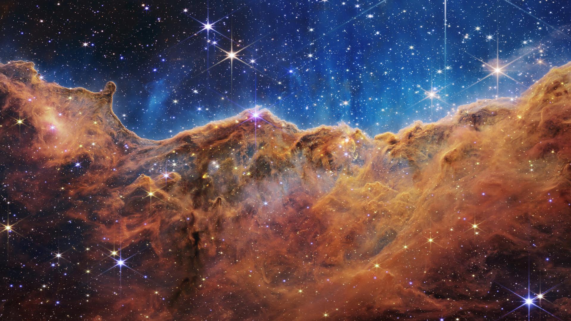JWST-Aufnahme des Carina-Nebels mit viel Gas, Staub und entstehenden Sternen. JWST-Aufnahme des Carina-Nebels mit viel Gas, Staub und entstehenden Sternen.