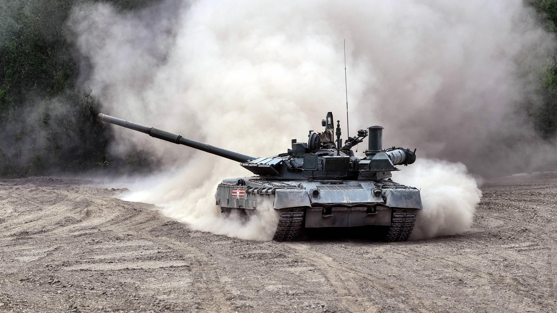 MURMANSK REGION, RUSSIA - JULY 5, 2022: Tank crews of a separate motor rifle brigade under the Russian Northern Fleet Army Corps practise skills acquired during the special military operation in Ukraine, driving T-80BVM tanks at one of the transpolar training ranges. MURMANSK REGION, RUSSIA - JULY 5, 2022: Tank crews of a separate motor rifle brigade under the Russian Northern Fleet Army Corps practise skills acquired during the special military operation in Ukraine, driving T-80BVM tanks at one of the transpolar training ranges.