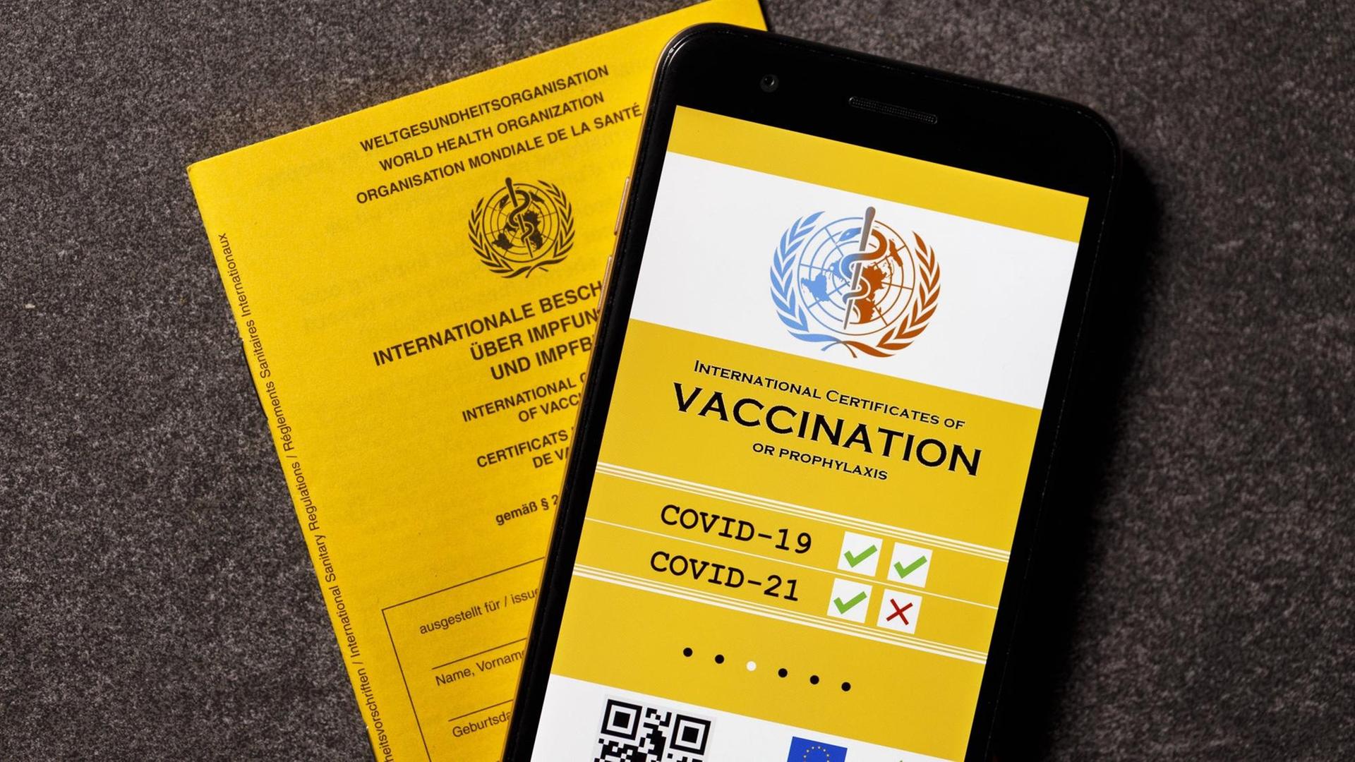 Eine mögliche Visualisierung des geplanten digitalen Impfpass liegt neben einem analogen Impfpass. Die EU-Staats- und Regierungschefs hatten am Donnerstag eine europäische Lösung beim Corona-Impfpass beschlossen. Themenbild, Symbolbild *** A possible visualisation of the planned digital vaccination card lies next to an analogue vaccination card The EU heads of state and government had decided on Thursday on a European solution for the Corona vaccination card Topic image, symbol image Foto:xC.xHardtx/xFuturexImage Eine mögliche Visualisierung des geplanten digitalen Impfpass liegt neben einem analogen Impfpass. Die EU-Staats- und Regierungschefs hatten am Donnerstag eine europäische Lösung beim Corona-Impfpass beschlossen. Themenbild, Symbolbild *** A possible visualisation of the planned digital vaccination card lies next to an analogue vaccination card The EU heads of state and government had decided on Thursday on a European solution for the Corona vaccination card Topic image, symbol image Foto:xC.xHardtx/xFuturexImage