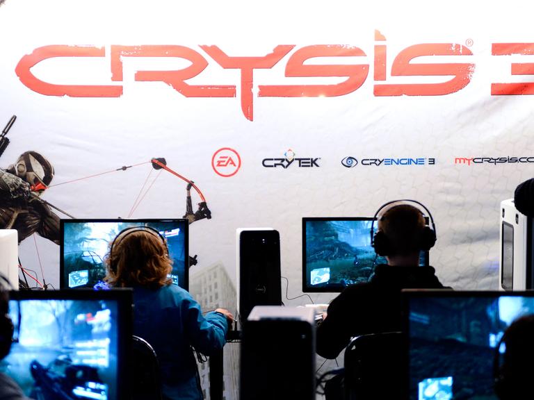 Computer gamers try the new and under develpment Crysis 3 computer game on November 1, 2012 during the Gamex fair at Kistamassan exhibition and event venue in Stockholm.