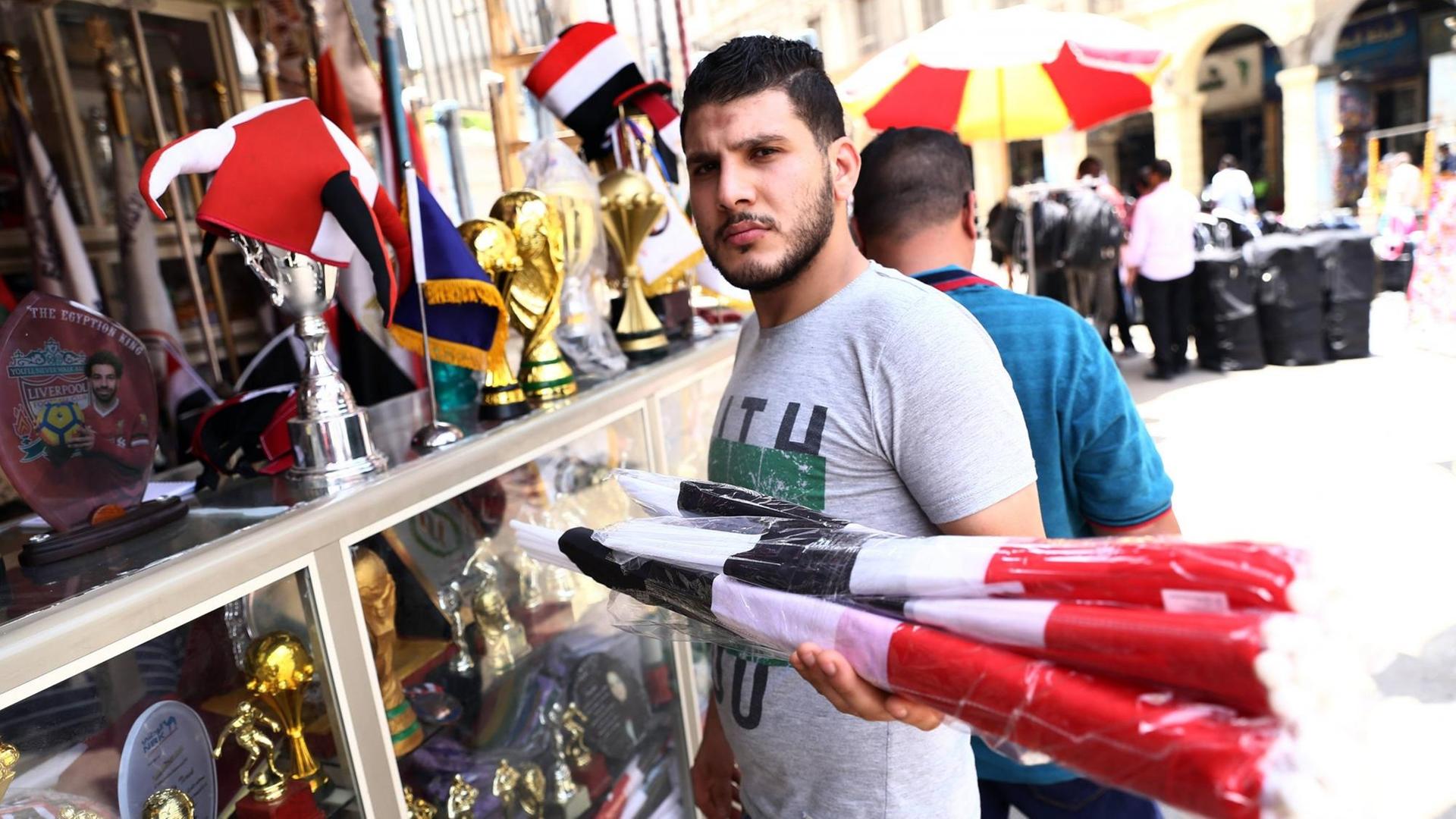 (190621) -- CAIRO, June 21, 2019 -- A man is seen at a stall selling flags in Attaba marketplace district before Africa Cup of Nations (AFCON) in Cairo, Egypt, June 20, 2019. TO GO WITH Feature: Flag sales flourish in Egypt amid Africa Cup of Nations ) EGYPT-CAIRO-AFRICAN CUP-FLAG SALES AhmedxGomaa PUBLICATIONxNOTxINxCHN