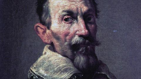 Der Komponsit auf einem Gemälde von 1620 von Domenico Fetti. An seinen hageren Gesichtszügen mit Bart ist zu sehen, dass Monteverdi unermüdlich arbeitete.