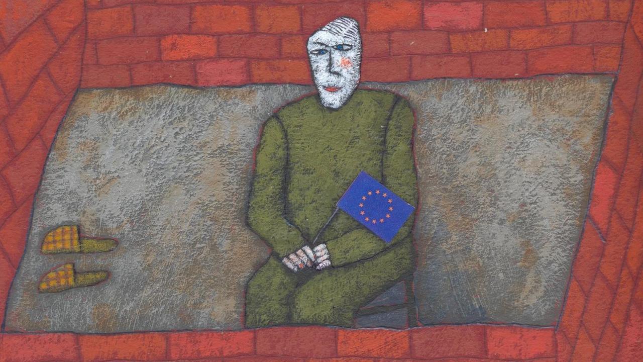 Eine Person sitzt mit einer Europaflagge hinter Mauern. (Illustration) Eine Person sitzt mit einer Europaflagge hinter Mauern. (Illustration)