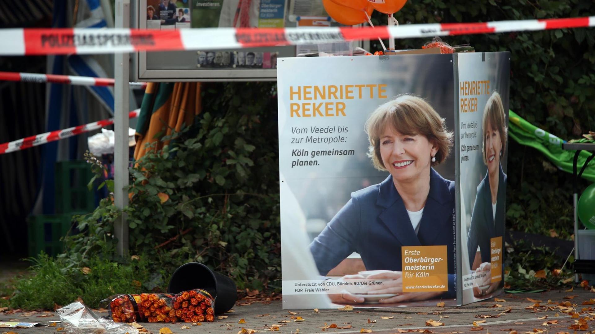 Ein Plakat der Kölner Obermeisterkandidatin Henriette Reker ist am 17.10.2015 in Köln (Nordrhein-Westfalen) am Tatort zu sehen. Ein Plakat der Kölner Obermeisterkandidatin Henriette Reker ist am 17.10.2015 in Köln (Nordrhein-Westfalen) am Tatort zu sehen.
