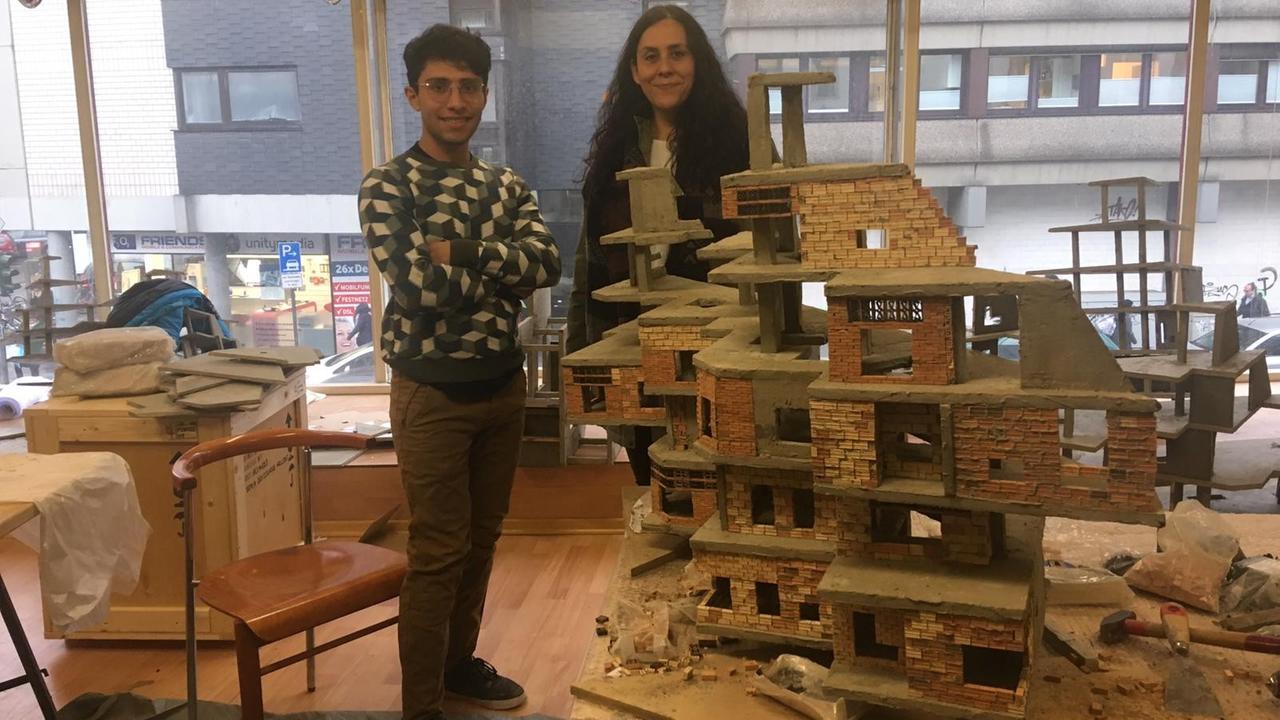 Mauricio Salcedo and Eloisa Castanon in front of the sculpture Mauricio Salcedo and Eloisa Castanon in front of the sculpture