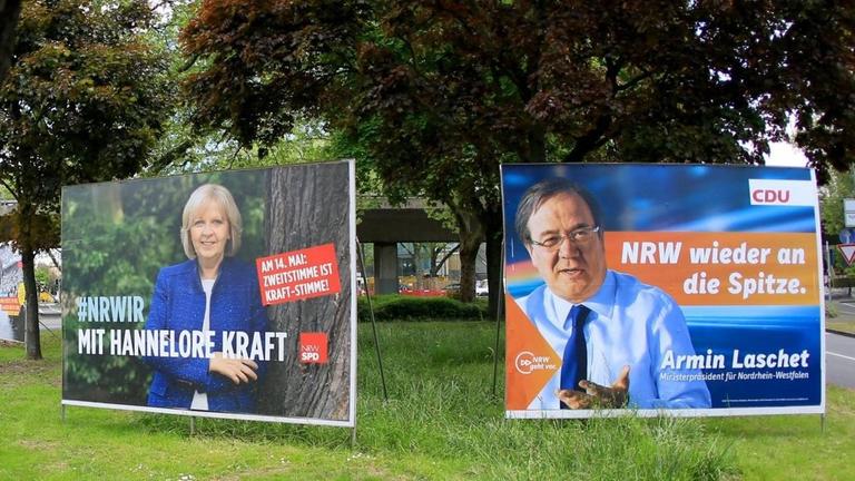 Plakate mit den Portraits von Ministerpräsidentin Hannelore Kraft (SPD) und Herausforderer Armin Laschet (CDU) zur Landtagswahl 2017 in Nordrhein-Westfalen stehen in Düsseldorf (NRW). Plakate mit den Portraits von Ministerpräsidentin Hannelore Kraft (SPD) und Herausforderer Armin Laschet (CDU) zur Landtagswahl 2017 in Nordrhein-Westfalen stehen in Düsseldorf (NRW).