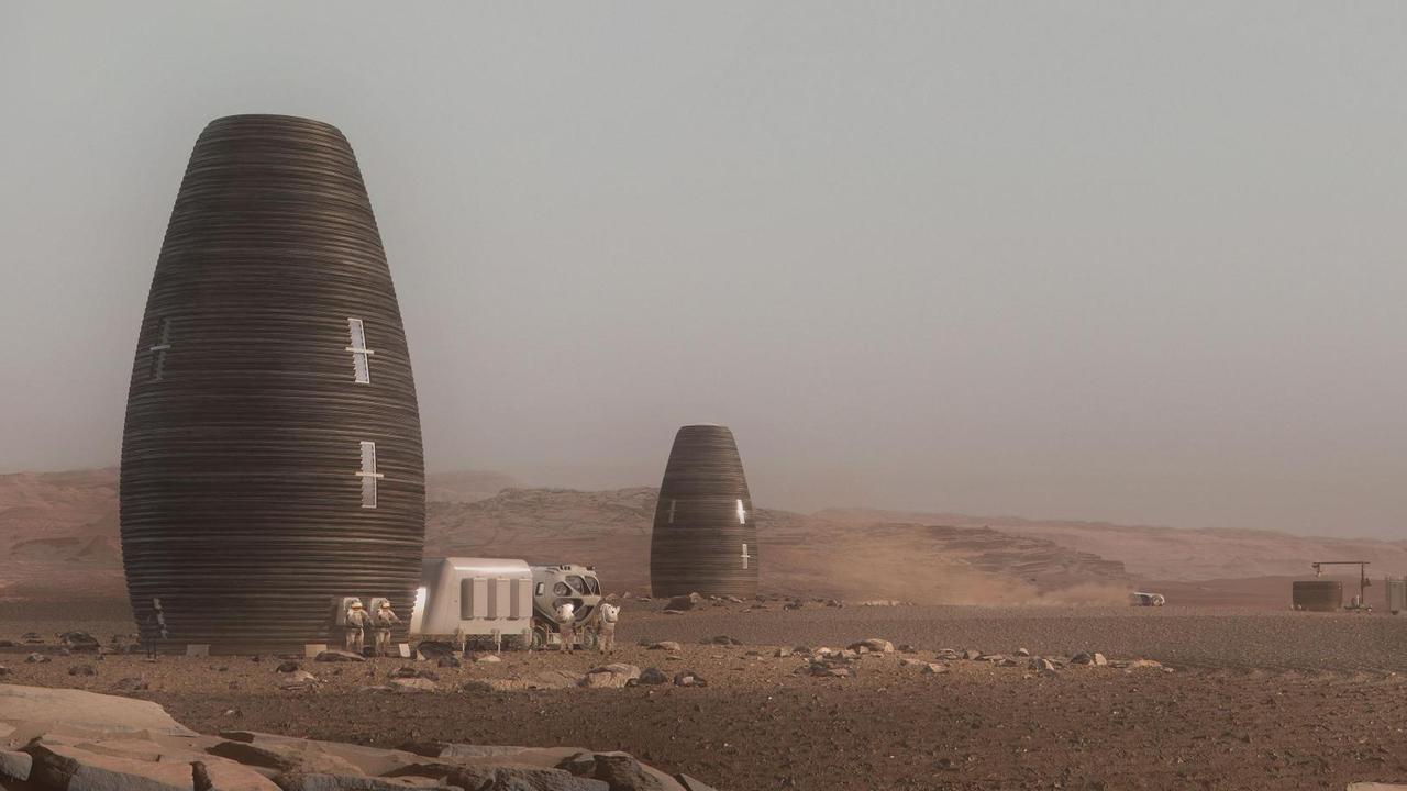 Silo-artige, wie einem Science-Fiction-Film entnommen wirkende Wohngebäude in einer Wüstenlandschaft. Silo-artige, wie einem Science-Fiction-Film entnommen wirkende Wohngebäude in einer Wüstenlandschaft.
