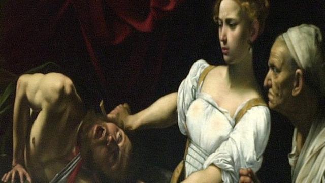 Zwei Museumsmitarbeiter zeigen das Gemälde "Judith enthauptet Holofernes" von Caravaggio. Das Gemälde, eine Leihgabe des Palazzo Barberini in Rom, war 2001 in der Berliner Nationalgalerie zu sehen.