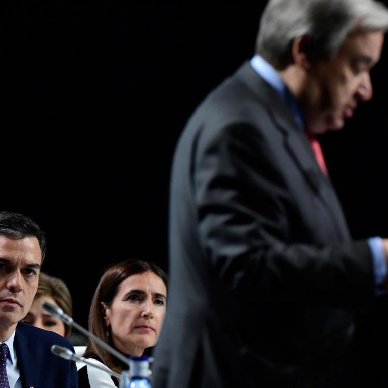 (FromL) Intergovernmental Panel on Climate Change (IPCC) chairman Hoesung Lee, Spain's Prime Minister Pedro Sanchez and Carolina Schmidt, Chile's Minister of Environment listen to United Nations Secretary General Antonio Guterres gives a speech at the UN Climate Change Conference COP25 at the 'IFEMA - Feria de Madrid' exhibition centre, in Madrid, on December 2, 2019. - Spain's Socialist government offered to host this year's UN climate conference, known as COP25, from December 2 to December 13, 2019, after the event's original host Chile withdrew last month due to deadly riots over economic inequality. (Photo by CRISTINA QUICLER / AFP)