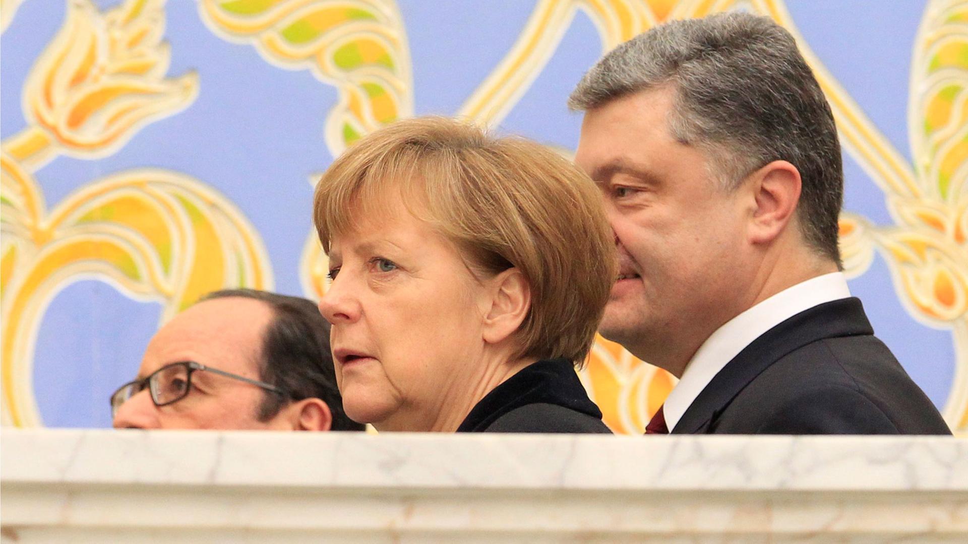 Francois Hollande, Angela Merkel und Petro Poroschenko beim Ukraine-Gipfel in Minsk Francois Hollande, Angela Merkel und Petro Poroschenko beim Ukraine-Gipfel in Minsk