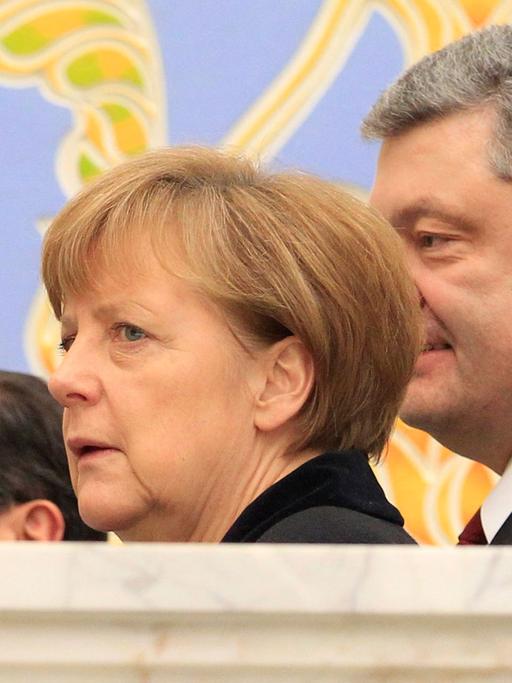 Francois Hollande, Angela Merkel und Petro Poroschenko beim Ukraine-Gipfel in Minsk