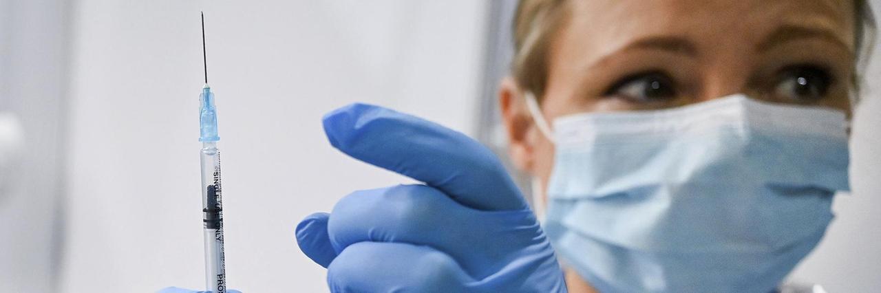 Paula McMahon prepares a shot of the Pfizer-BioNTech COVID-19 vaccine, as the mass public vaccination program gets underway, at the NHS Louisa Jordan Hospital in Glasgow, Scotland, Tuesday Dec. 8, 2020. The United Kingdom is beginning its vaccination campaign to inoculate people against the COVID-19 virus. (Jeff J Mitchell/Pool via AP) Paula McMahon prepares a shot of the Pfizer-BioNTech COVID-19 vaccine, as the mass public vaccination program gets underway, at the NHS Louisa Jordan Hospital in Glasgow, Scotland, Tuesday Dec. 8, 2020. The United Kingdom is beginning its vaccination campaign to inoculate people against the COVID-19 virus. (Jeff J Mitchell/Pool via AP)