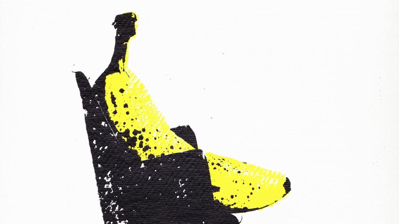 Illustration einer Banane, die auf einem Chefsessel sitzt. Illustration einer Banane, die auf einem Chefsessel sitzt.