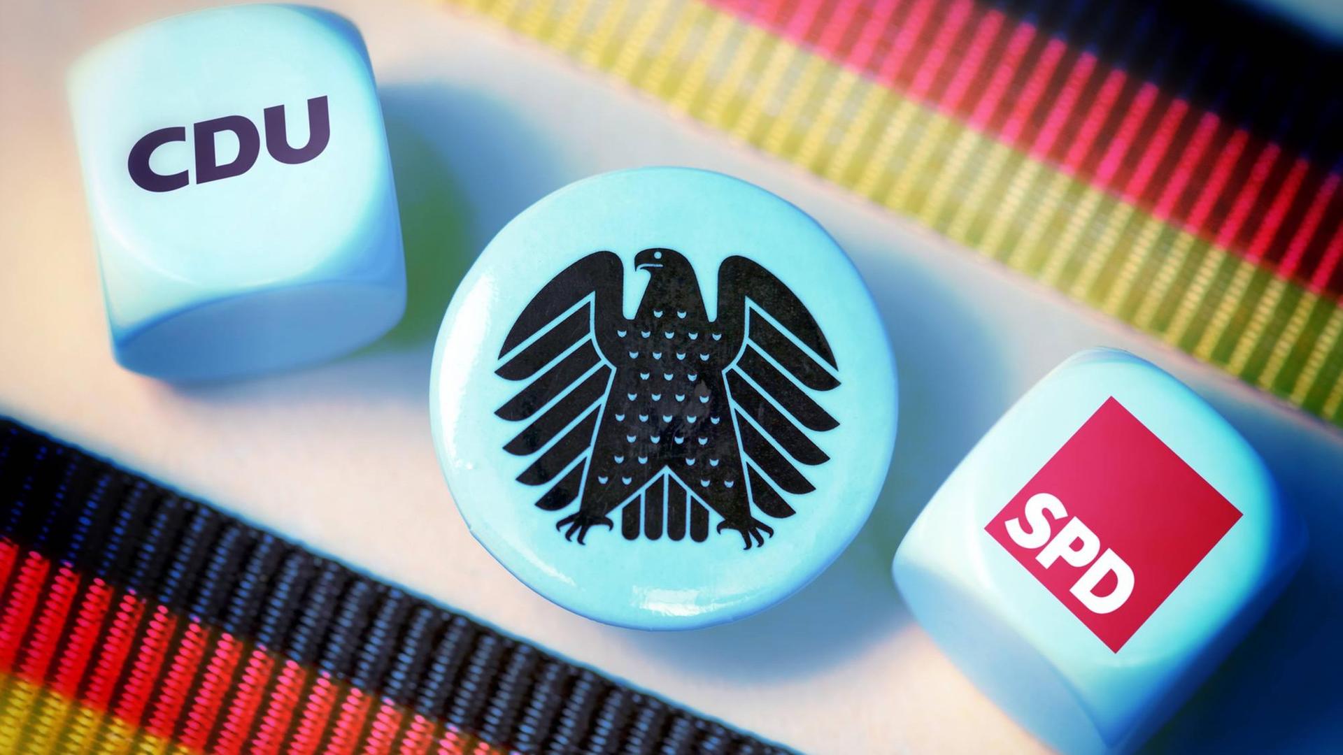 Würfel mit dem Logo von CDU und SPD, Symbolfoto für die Große Koalition