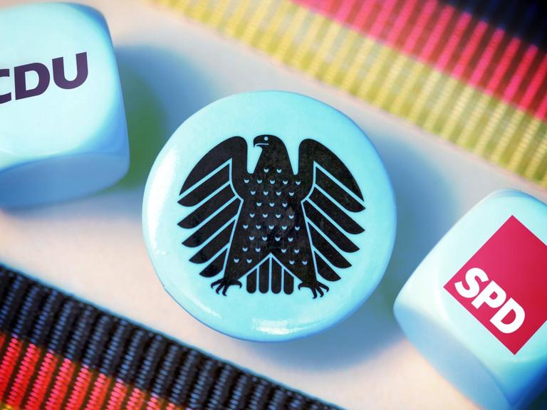 Würfel mit dem Logo von CDU und SPD, Symbolfoto für die Große Koalition