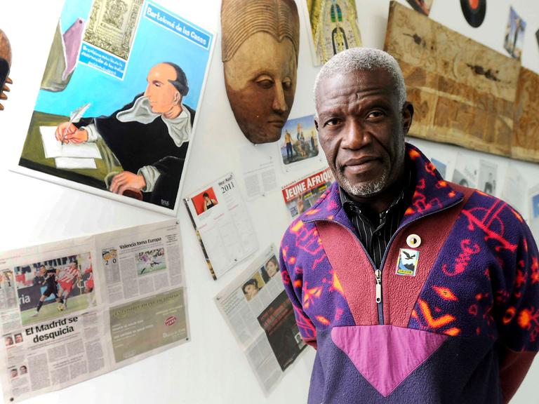 Beninese artist Georges Adeagbo poses next one of his artworks during an interview with Spanish press agency EFE at the Museo de Arte Contemporaneo de Castilla y Leon (MUSAC) in Leon, Spain, 27 January 2011. The MUSAC presents an Adeagbo exhibition, entitled The Mission and the Missionaries, that will be inaugurated on 29 January.
