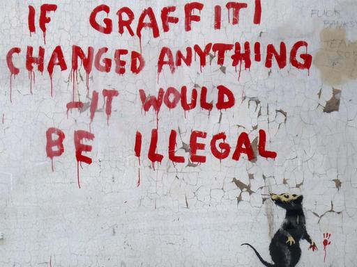 LONDON, ENGLAND - OCTOBER 6: A new stencil and spray paint artwork, by guerilla graffiti artist Banksy, appears in Fitzrovia, October 6, 2011 in London, England. The piece, that shows a rat having written a message which reads "If Graffiti changed anything - it would be illegal", has been covered in plexiglass in order to protect it. (Photo by Jim Dyson/Getty Images)