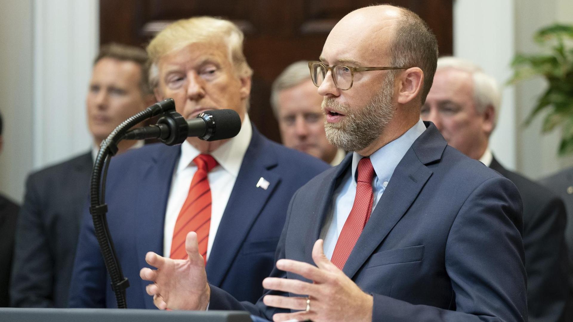 October 9, 2019, Washington, DC, United States of America: U.S President Donald Trump, left, listens to Office of Management and Budget Acting Director Russ Vought, before signing Executive Orders on Transparency in Federal Guidance and Enforcement during a ceremony in the Roosevelt Room of the White House October 9, 2019 in Washington, DC. (Credit Image: © Shealah Craighead via ZUMA Wire | October 9, 2019, Washington, DC, United States of America: U.S President Donald Trump, left, listens to Office of Management and Budget Acting Director Russ Vought, before signing Executive Orders on Transparency in Federal Guidance and Enforcement during a ceremony in the Roosevelt Room of the White House October 9, 2019 in Washington, DC. (Credit Image: © Shealah Craighead via ZUMA Wire |