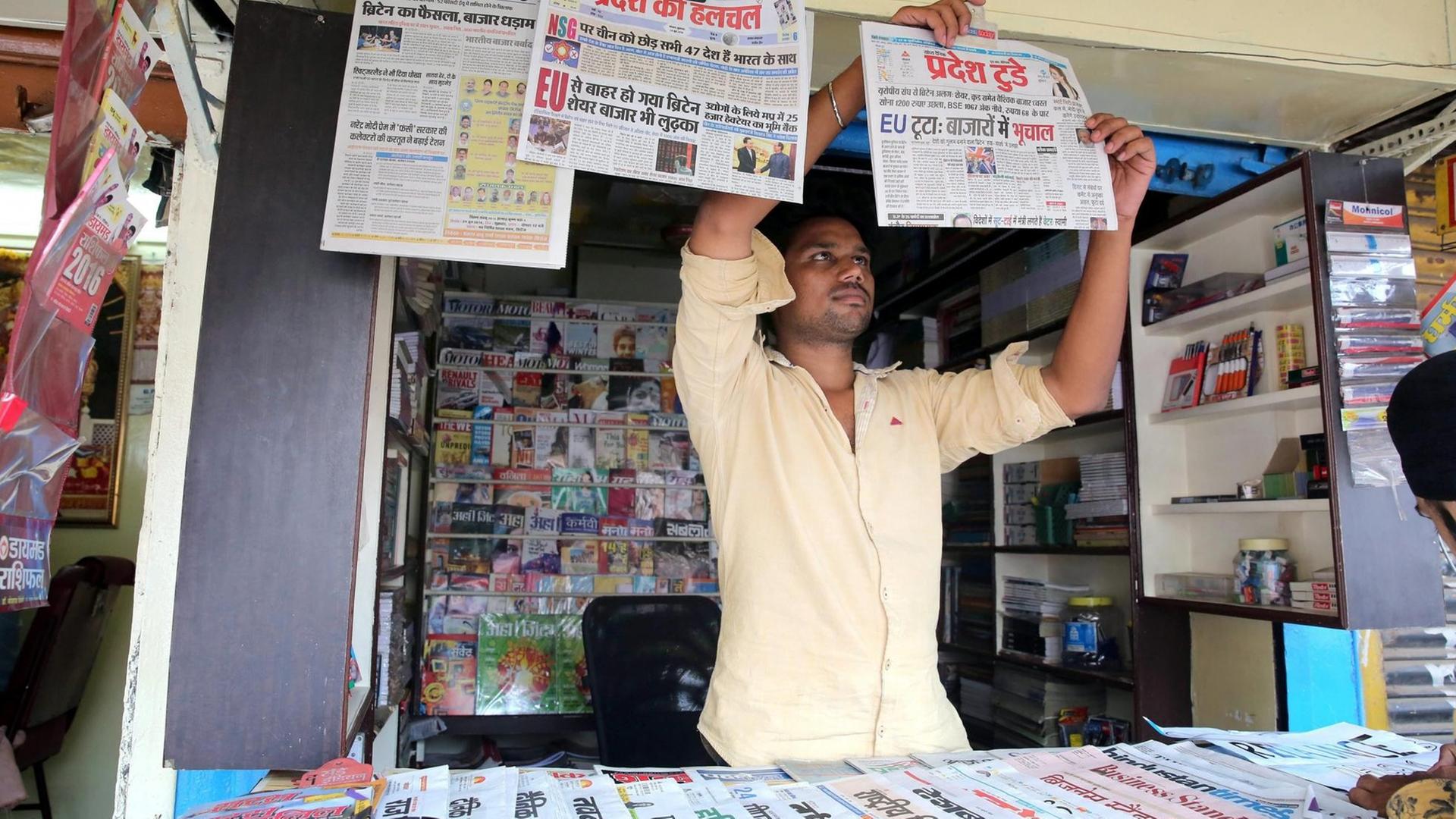Indian newspaper vendor arrange the evening editions of the Hindi newspapers with the headline about the Brexit in Bhopal, India, 24 June 2016. Brexit effected Indian markets and had lost nearly 1,090 points at one state after Britons in a referendum on 23 June have voted by a narrow margin to leave the European Union (EU). Media reports on early 24 June indicate that 51.9 per cent voted in favour of leaving the EU while 48.1 per cent voted for remaining in. EPA/SANJEEV GUPTA | Indian newspaper vendor arrange the evening editions of the Hindi newspapers with the headline about the Brexit in Bhopal, India, 24 June 2016. Brexit effected Indian markets and had lost nearly 1,090 points at one state after Britons in a referendum on 23 June have voted by a narrow margin to leave the European Union (EU). Media reports on early 24 June indicate that 51.9 per cent voted in favour of leaving the EU while 48.1 per cent voted for remaining in. EPA/SANJEEV GUPTA |