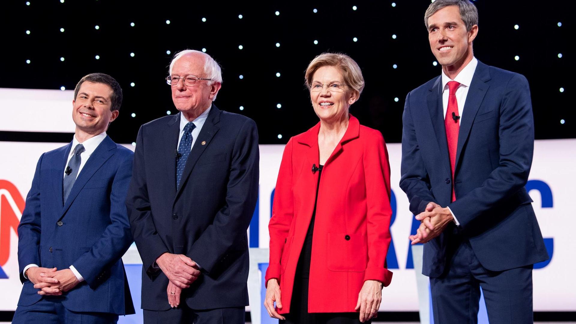 From left to right, Mayor Pete Buttigieg, Sen. Bernie Sanders, I-VT, Sen. Elizabeth Warren, D-MA, and Rep. Beto O'Rourke, D-TX, stand together as they are introduced at the start of the CNN Democratic Presidential Debate at the Fox Theater in Detroit on Tuesday, July 30, 2019. The qualifying field of 20 candidates were split evenly for the two-day debate. Photo by Kevin Dietsch/UPI Photo via Newscom picture alliance | From left to right, Mayor Pete Buttigieg, Sen. Bernie Sanders, I-VT, Sen. Elizabeth Warren, D-MA, and Rep. Beto O'Rourke, D-TX, stand together as they are introduced at the start of the CNN Democratic Presidential Debate at the Fox Theater in Detroit on Tuesday, July 30, 2019. The qualifying field of 20 candidates were split evenly for the two-day debate. Photo by Kevin Dietsch/UPI Photo via Newscom picture alliance |