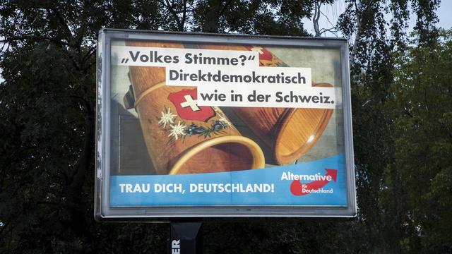 September 15, 2017 - Berlin, Germany - An election poster of the populist right-wing Alternative fuer Deutschland (Alternative for Germany, AfD) party reading people s voise? democratic like in Switzerland is pictured in the district of Marzahn in Berlin, Germany on September 15, 2017. Berlin Germany PUBLICATIONxINxGERxSUIxAUTxONLY - ZUMAn230 20170915_zaa_n230_844 Copyright: xEmmanuelexContinix