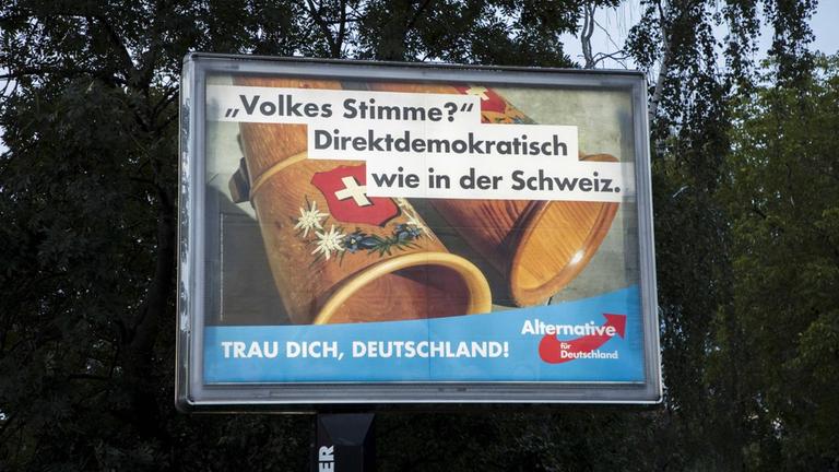 September 15, 2017 - Berlin, Germany - An election poster of the populist right-wing Alternative fuer Deutschland (Alternative for Germany, AfD) party reading people s voise? democratic like in Switzerland is pictured in the district of Marzahn in Berlin, Germany on September 15, 2017. Berlin Germany PUBLICATIONxINxGERxSUIxAUTxONLY - ZUMAn230 20170915_zaa_n230_844 Copyright: xEmmanuelexContinix