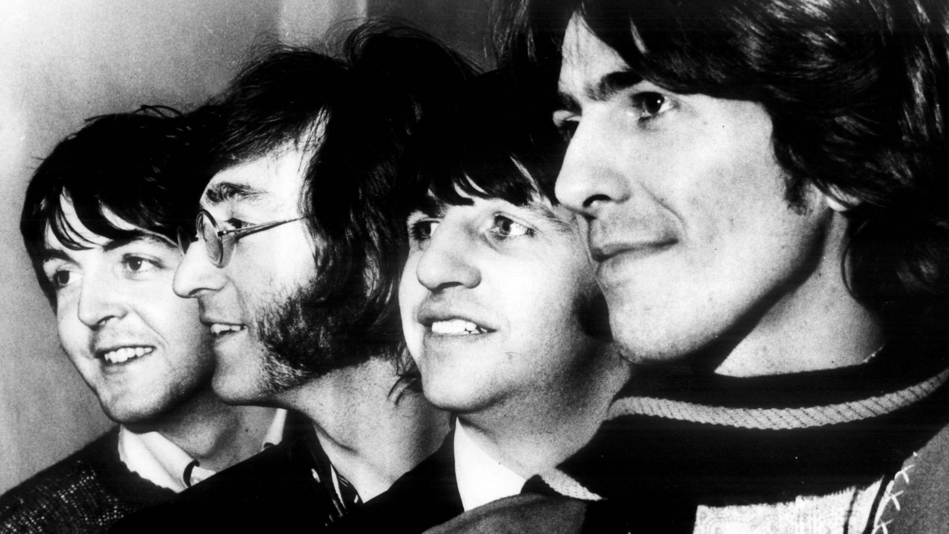 Die Konterfeis der Beatles nebeneinander Die Konterfeis der Beatles nebeneinander