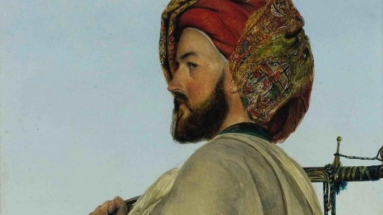 Das Gemälde von John Frederick Lewis aus dem Jahr 1868 (A Memlook Bey, Egypt), zeigt einen Mann (Selbstportrait) mit Turban und Kleidung des Mittleren Ostens. Das Gemälde von John Frederick Lewis aus dem Jahr 1868 (A Memlook Bey, Egypt), zeigt einen Mann (Selbstportrait) mit Turban und Kleidung des Mittleren Ostens.