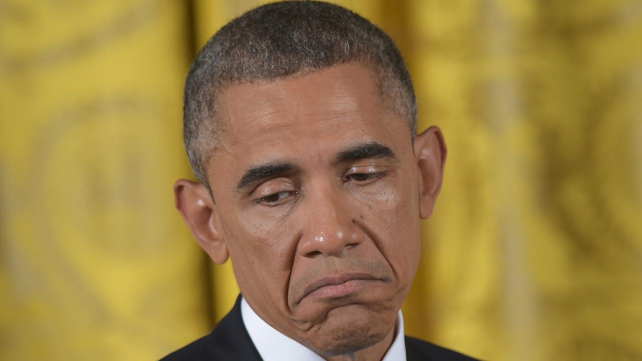 Barack Obama während der Pressekonferenz. Er zieht die Mundwinkel nach unten. Barack Obama während der Pressekonferenz. Er zieht die Mundwinkel nach unten.