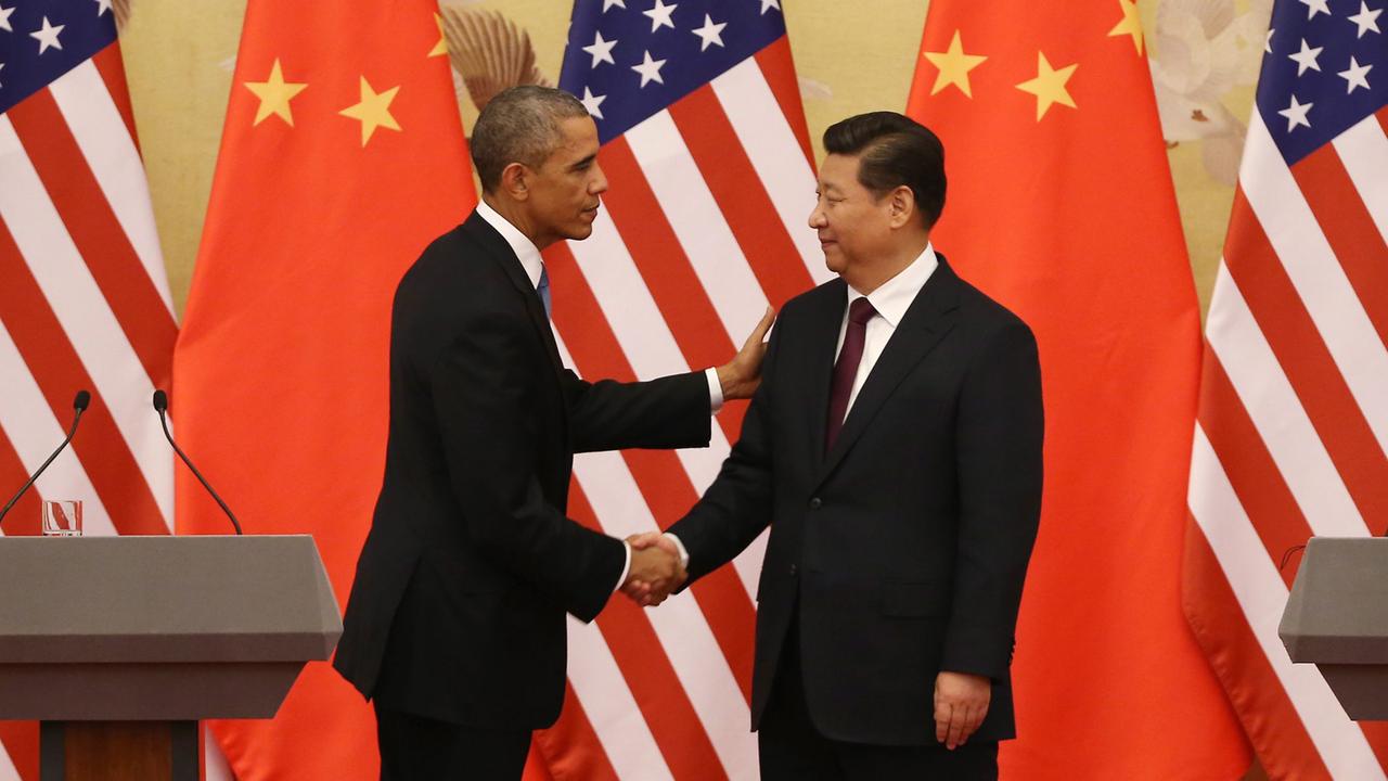 US-Präsident Obama und Chinas Staatspräsident Xi schütteln sich die Hände. US-Präsident Obama und Chinas Staatspräsident Xi schütteln sich die Hände.