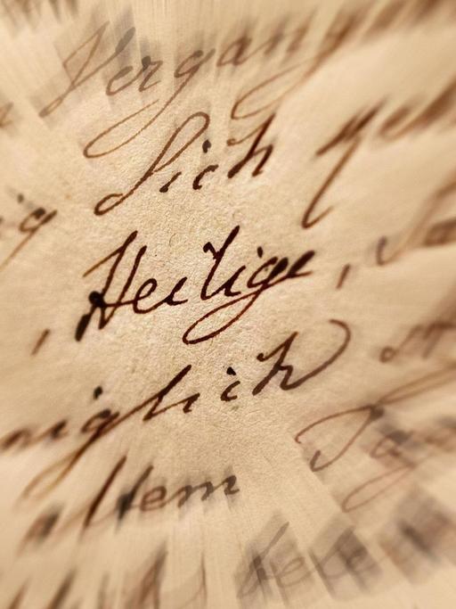 Autograph von Johann Wolfgang von Goethe - Den Drillingsfreunden von Köln, 1814, Eisengallustinte auf Velin zum Teil mit geprägtem Ornamentrand.