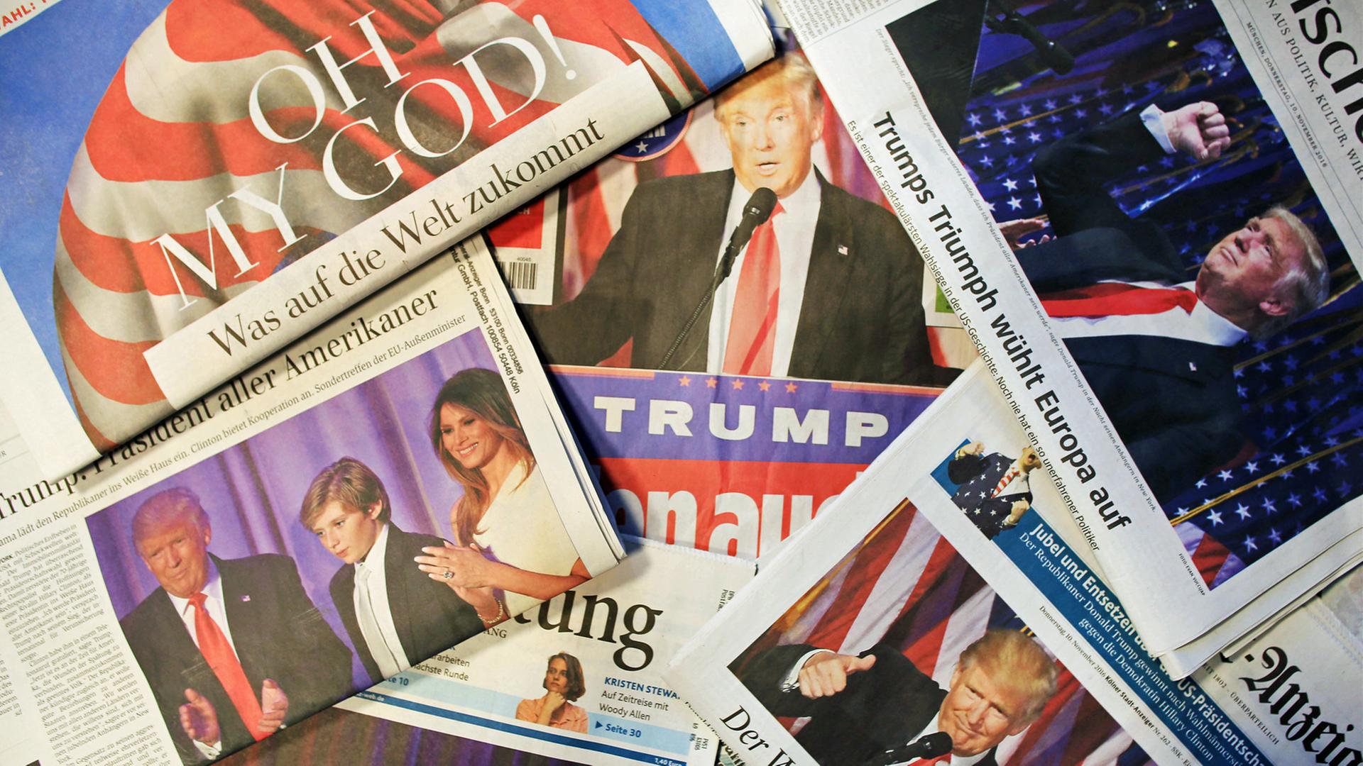 Zeitungen mit Titeln zur US-Wahl und dem Sieg von Donald Trump Zeitungen mit Titeln zur US-Wahl und dem Sieg von Donald Trump