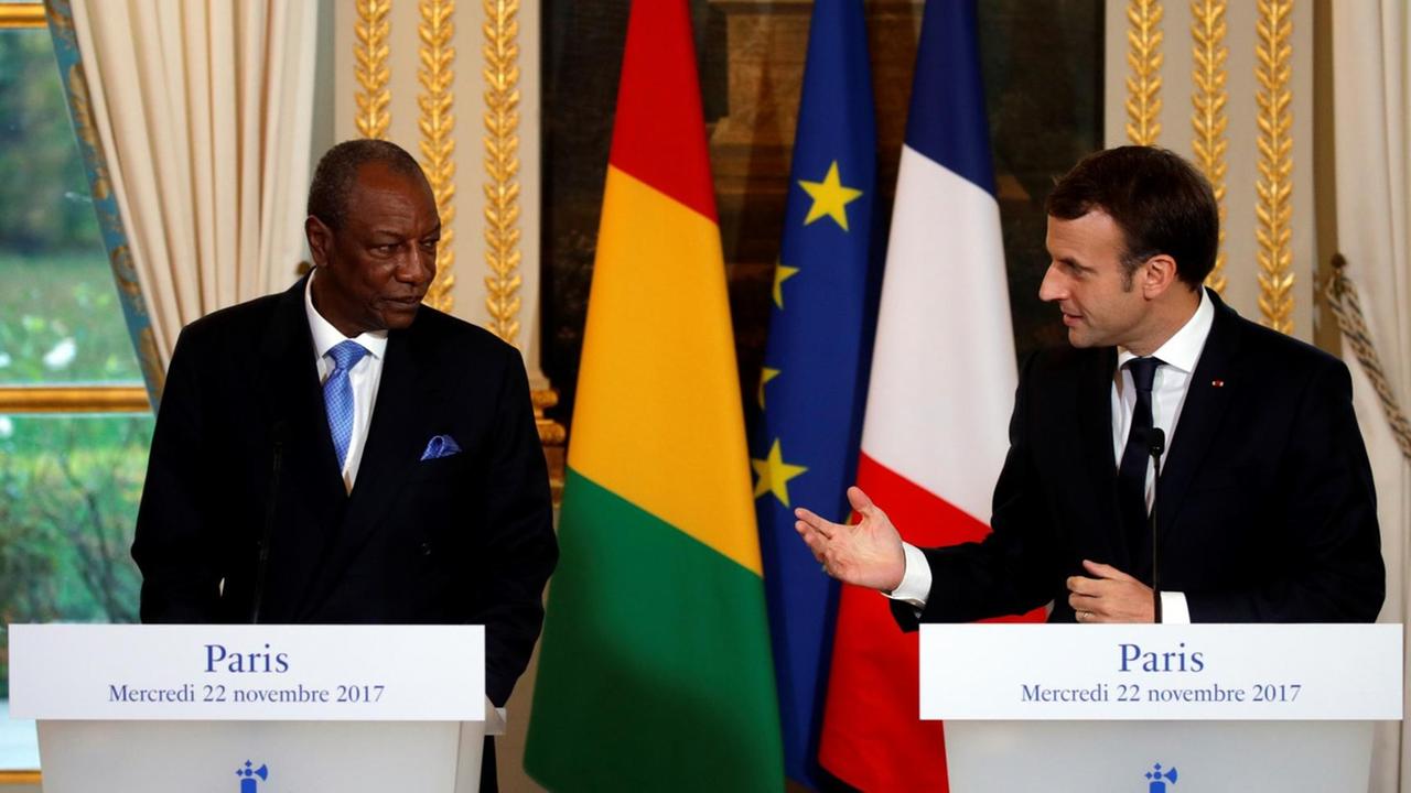 French President Emmanuel Macron (R) and Guinea's President Alpha Condé hold a joint press conference following a meeting at the Elysée Palace in Paris, on November 22, 2017. French President Emmanuel Macron (R) and Guinea's President Alpha Condé hold a joint press conference following a meeting at the Elysée Palace in Paris, on November 22, 2017.