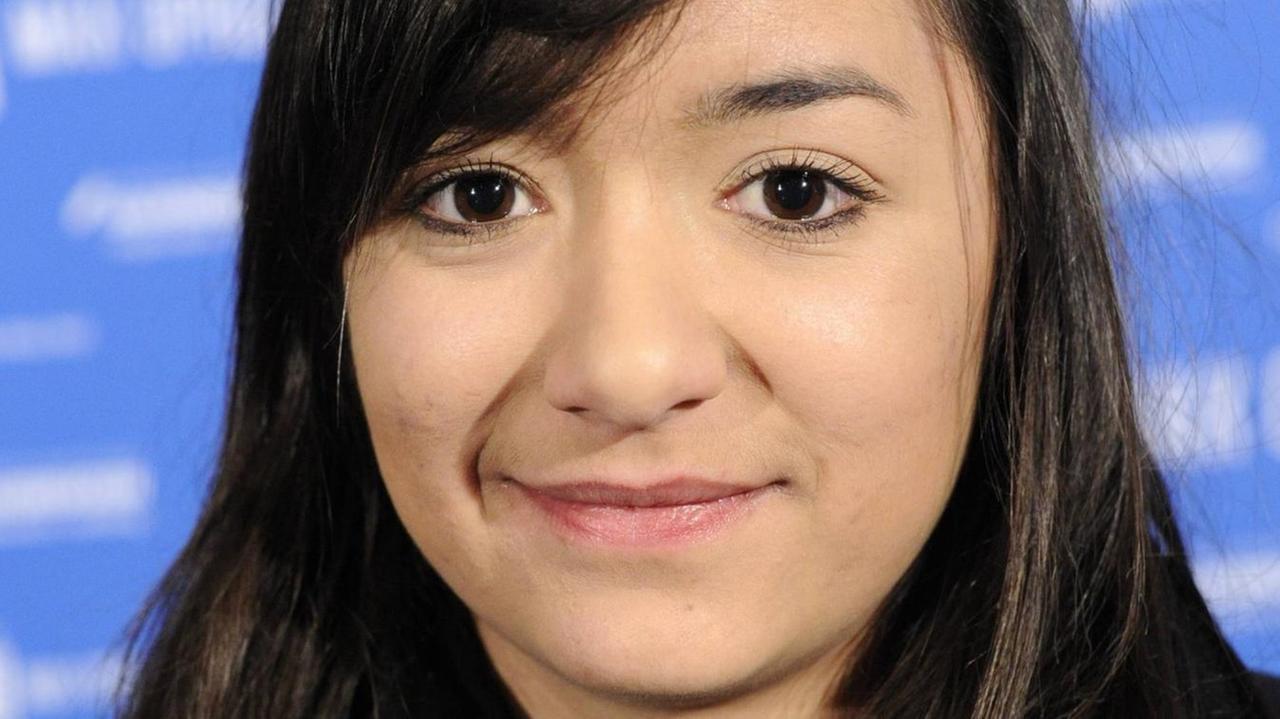 Die Regisseurin Mariko Minoguchi ist auf einem Filmfestival zu sehen. Die Regisseurin Mariko Minoguchi ist auf einem Filmfestival zu sehen.