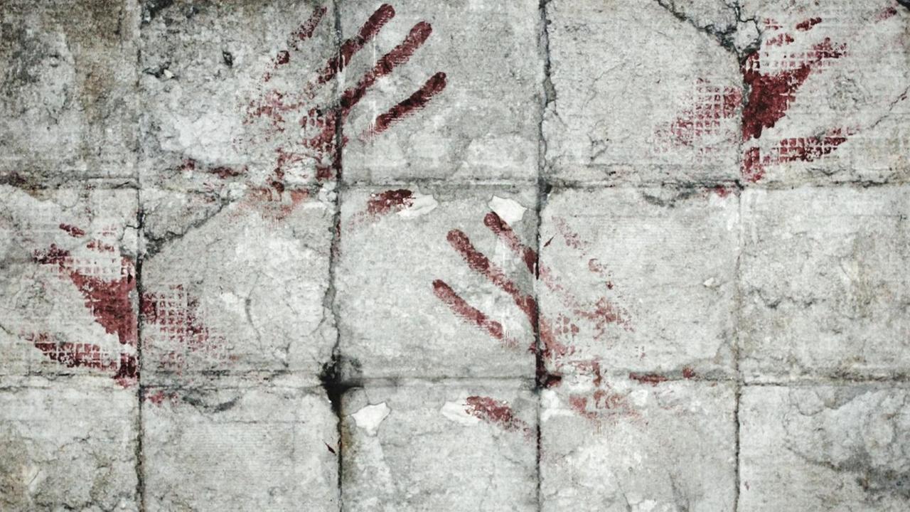 Blutige Abdrücke an einer Wand. Blutige Abdrücke an einer Wand.
