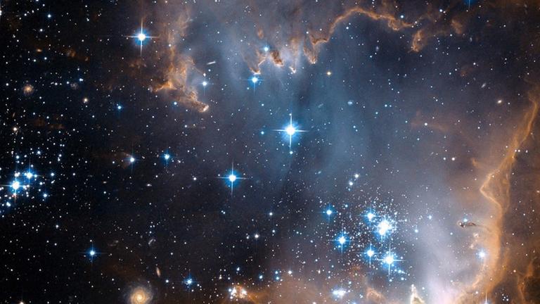 Ein Bild, das das "Hubble"-Weltraumteleskop aufgenommen hat. Es zeigt das Sternentstehungsgebiet N90 in der Kleinen Magellanischen Wolke - einer Begleitgalaxie der Milchstraße. Ein Bild, das das "Hubble"-Weltraumteleskop aufgenommen hat. Es zeigt das Sternentstehungsgebiet N90 in der Kleinen Magellanischen Wolke - einer Begleitgalaxie der Milchstraße.