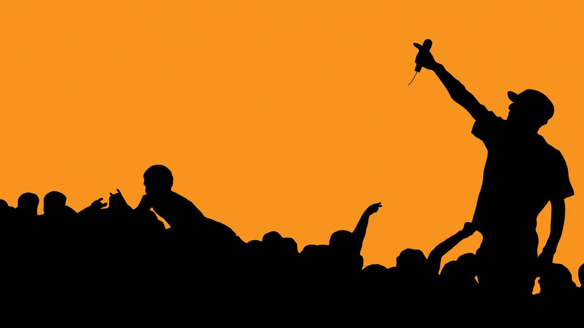 Silhouette eines Rappers während eines Konzerts Silhouette eines Rappers während eines Konzerts
