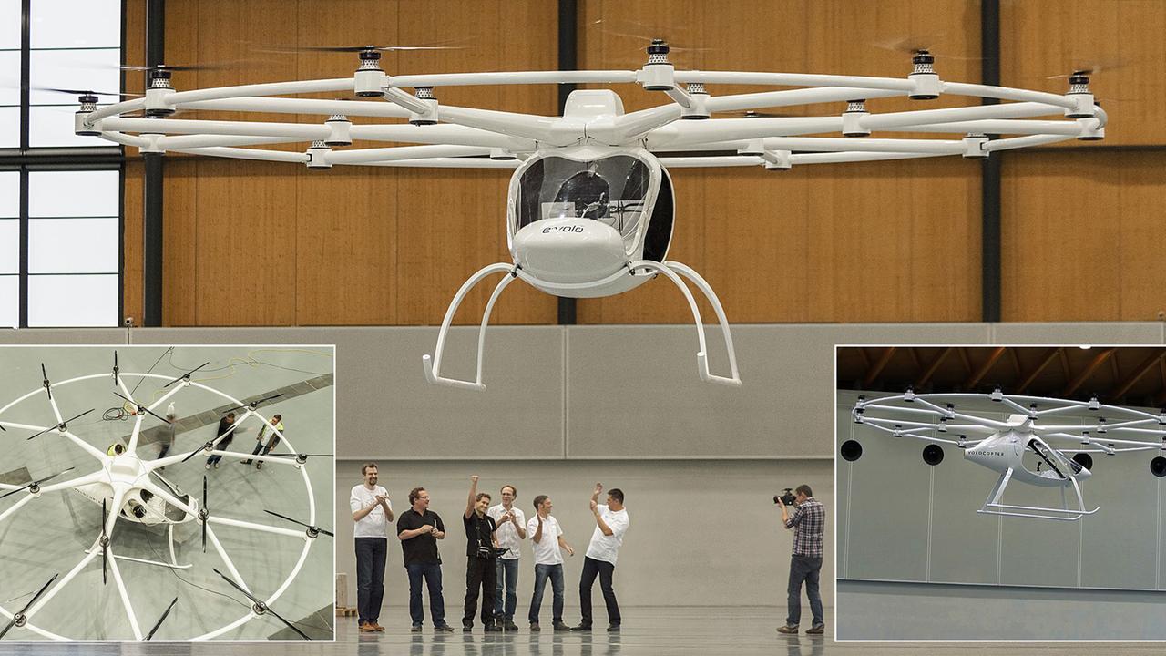 Der e-Volo-Multikopter flog zum ersten Mal in einer Halle. Er ist ein einsitziges Luftfahrzeug mit zahlreichen Rotoren. Der e-Volo-Multikopter flog zum ersten Mal in einer Halle. Er ist ein einsitziges Luftfahrzeug mit zahlreichen Rotoren.